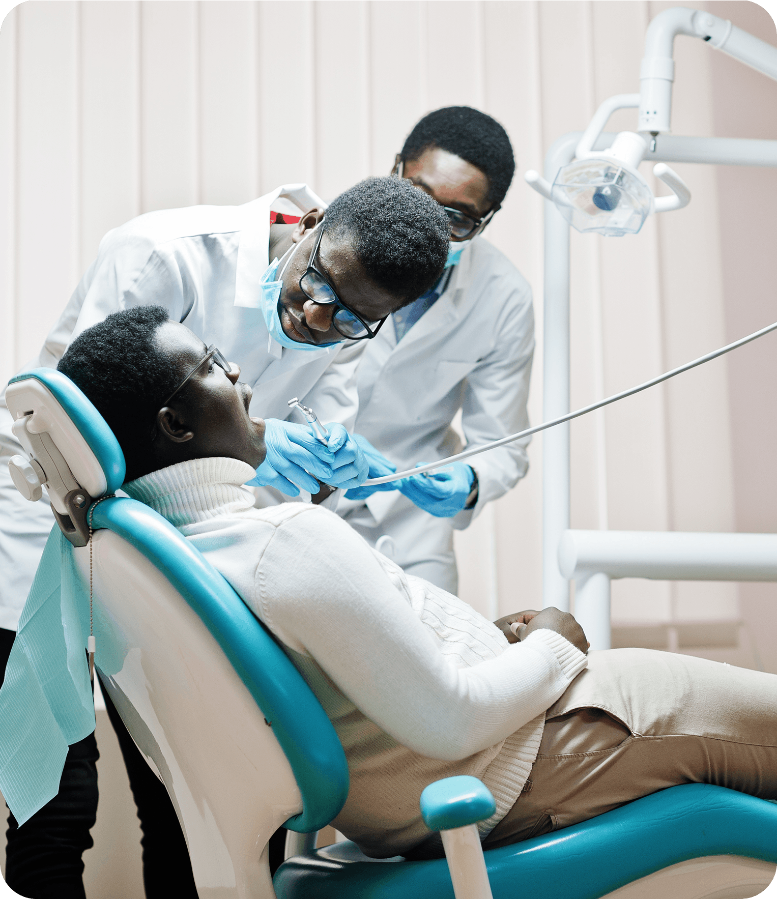 Dentist treating patient in dental chair