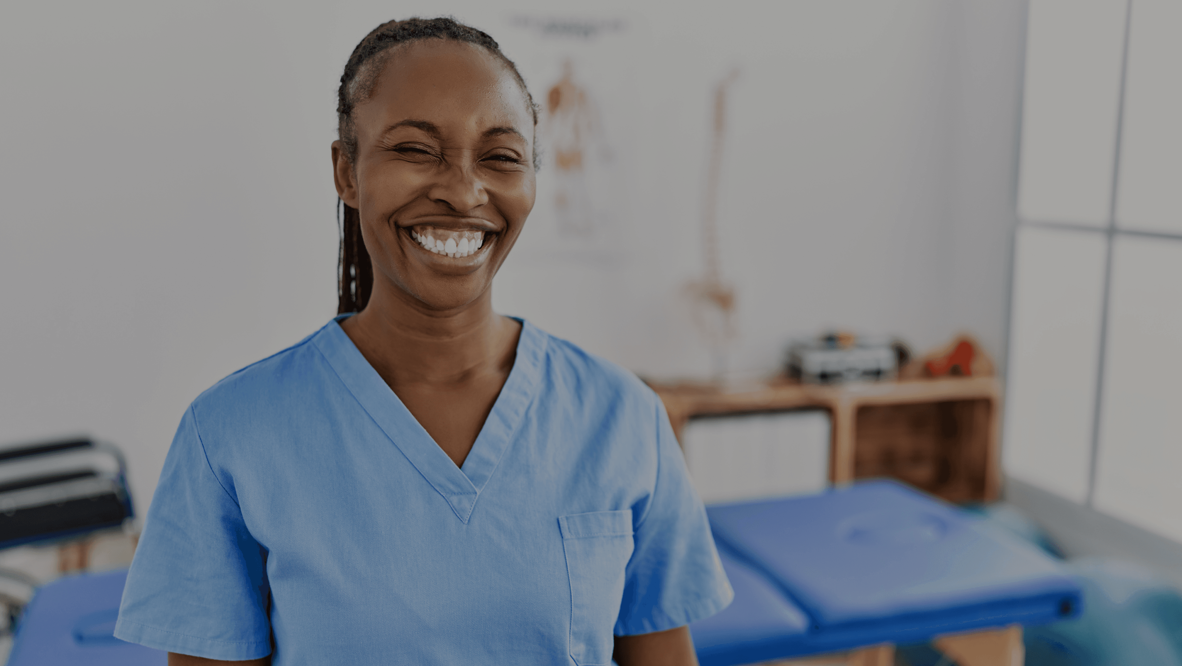 Dental professional smiling in a modern clinic