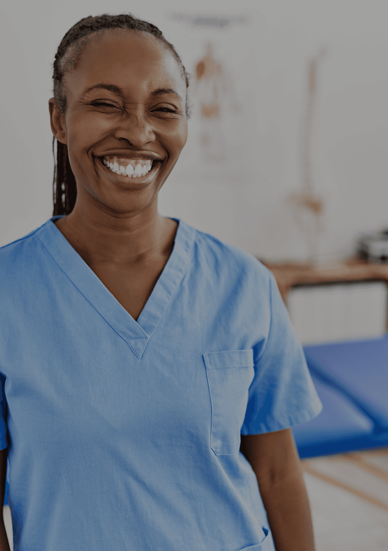 Dental professional smiling in a modern clinic