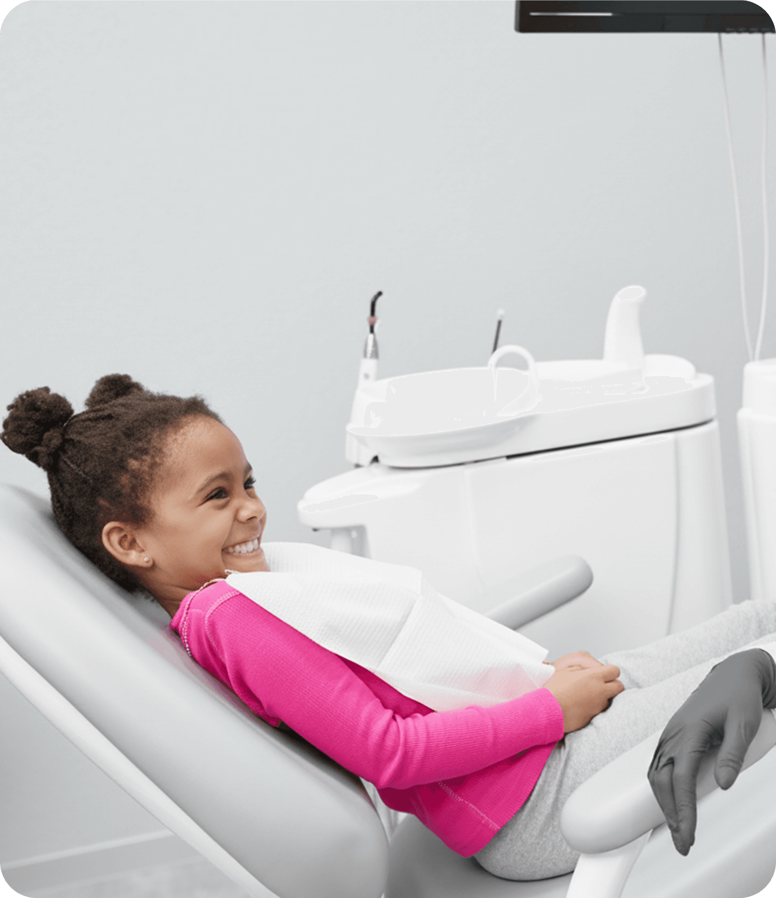 Child patient smiling in dental chair